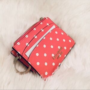Kate Spade poked its pink key holder and wallet NWOT